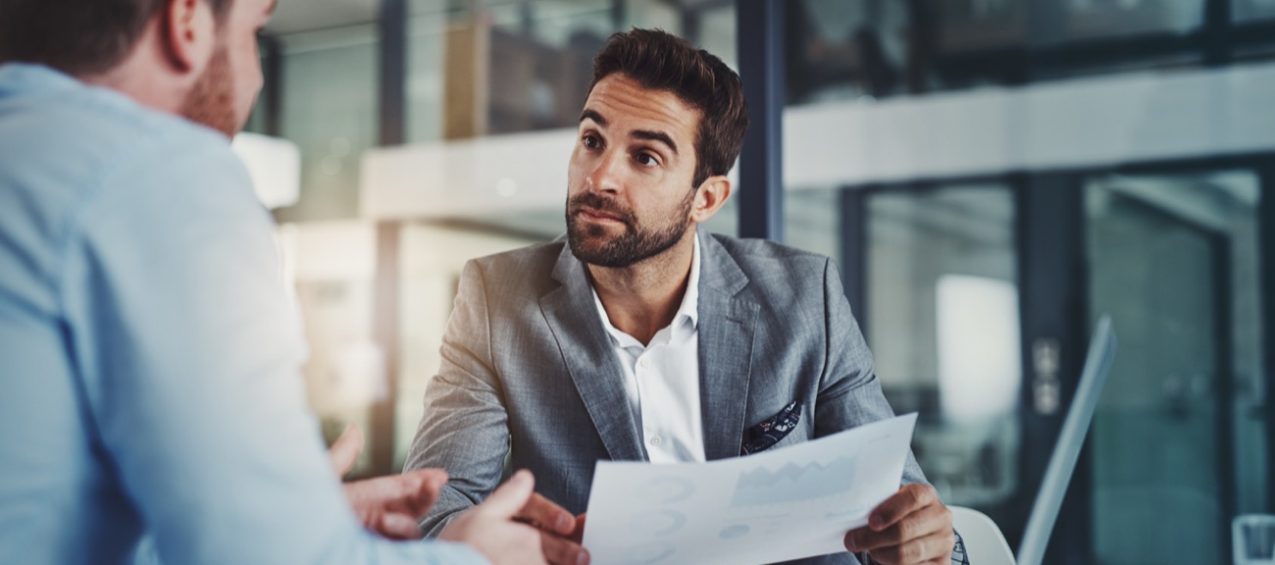 Accounting professionals reviewing financial documents and approvals