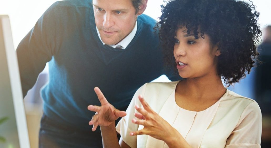 Financial services professionals reviewing a business document
